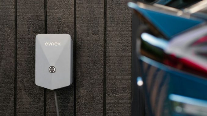 a car plugged in to a wall charger