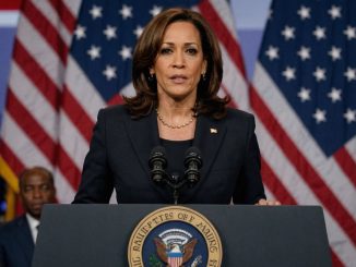 Kamala Harris at podium with American flag