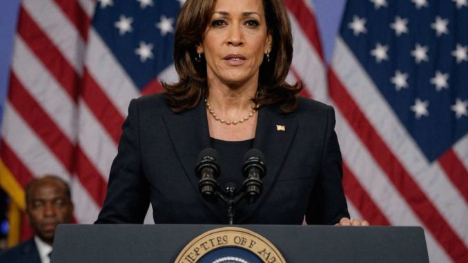 Kamala Harris at podium with American flag